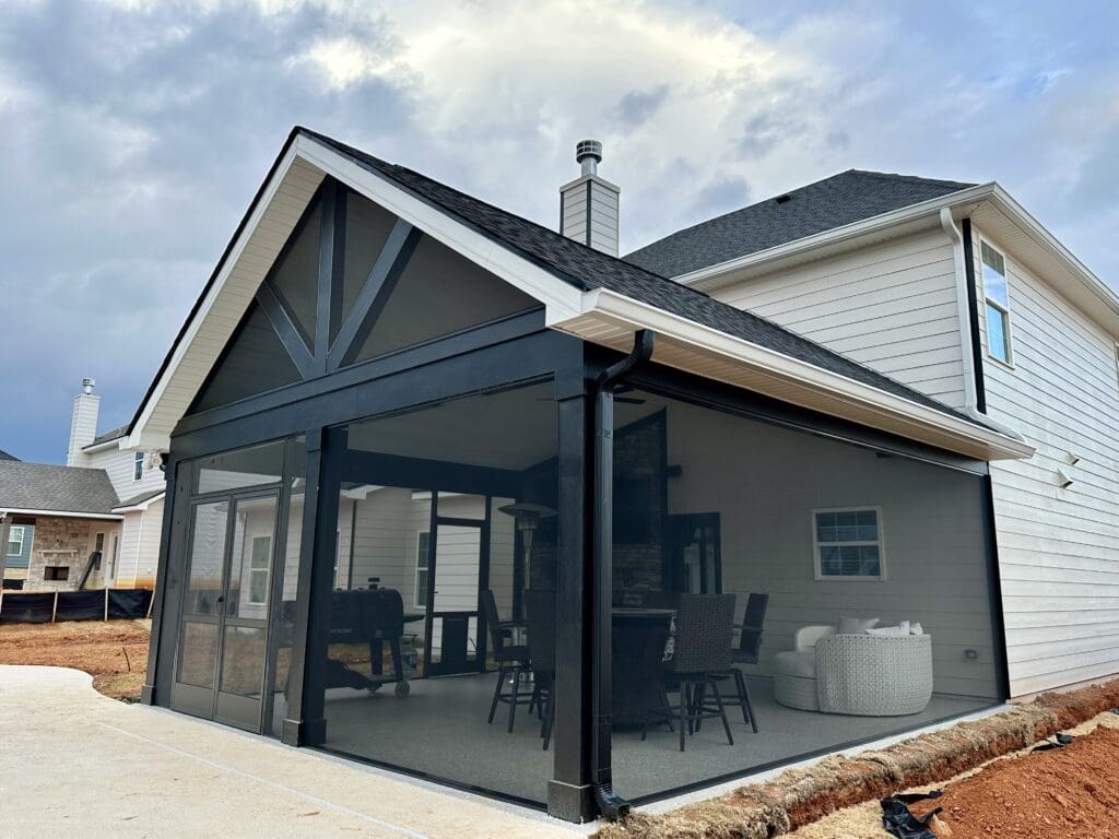Modern home with black screened-in patio