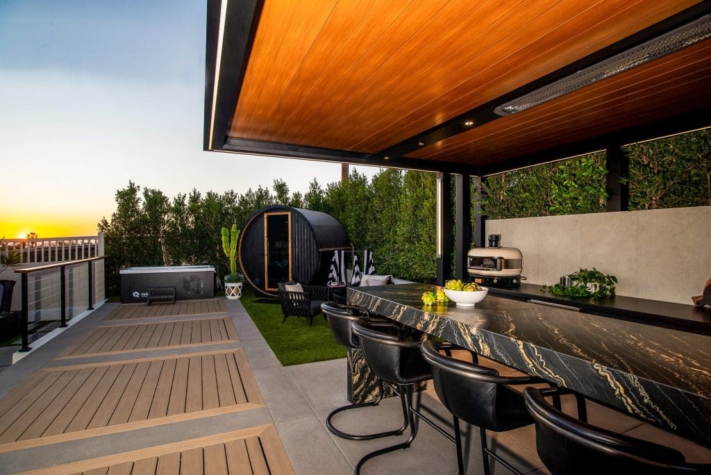 Cantilevered Patio Cover with wood ceiling look, marble bar and sauna