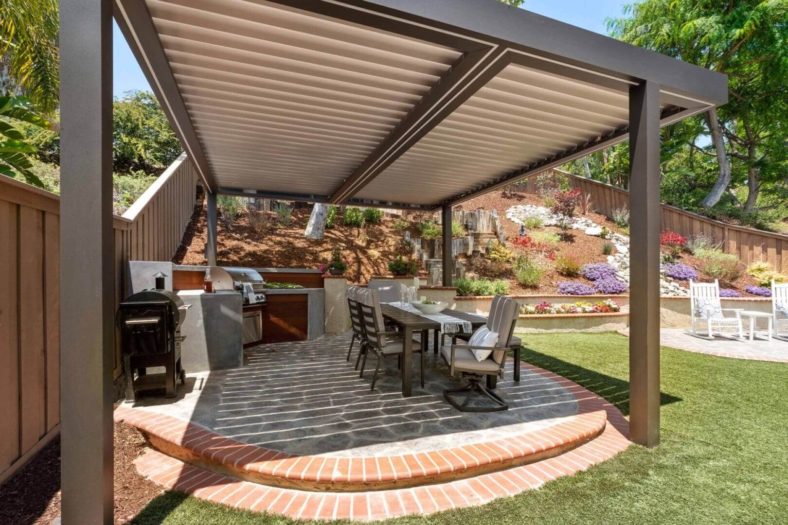 Pergola-covered patio with dining table