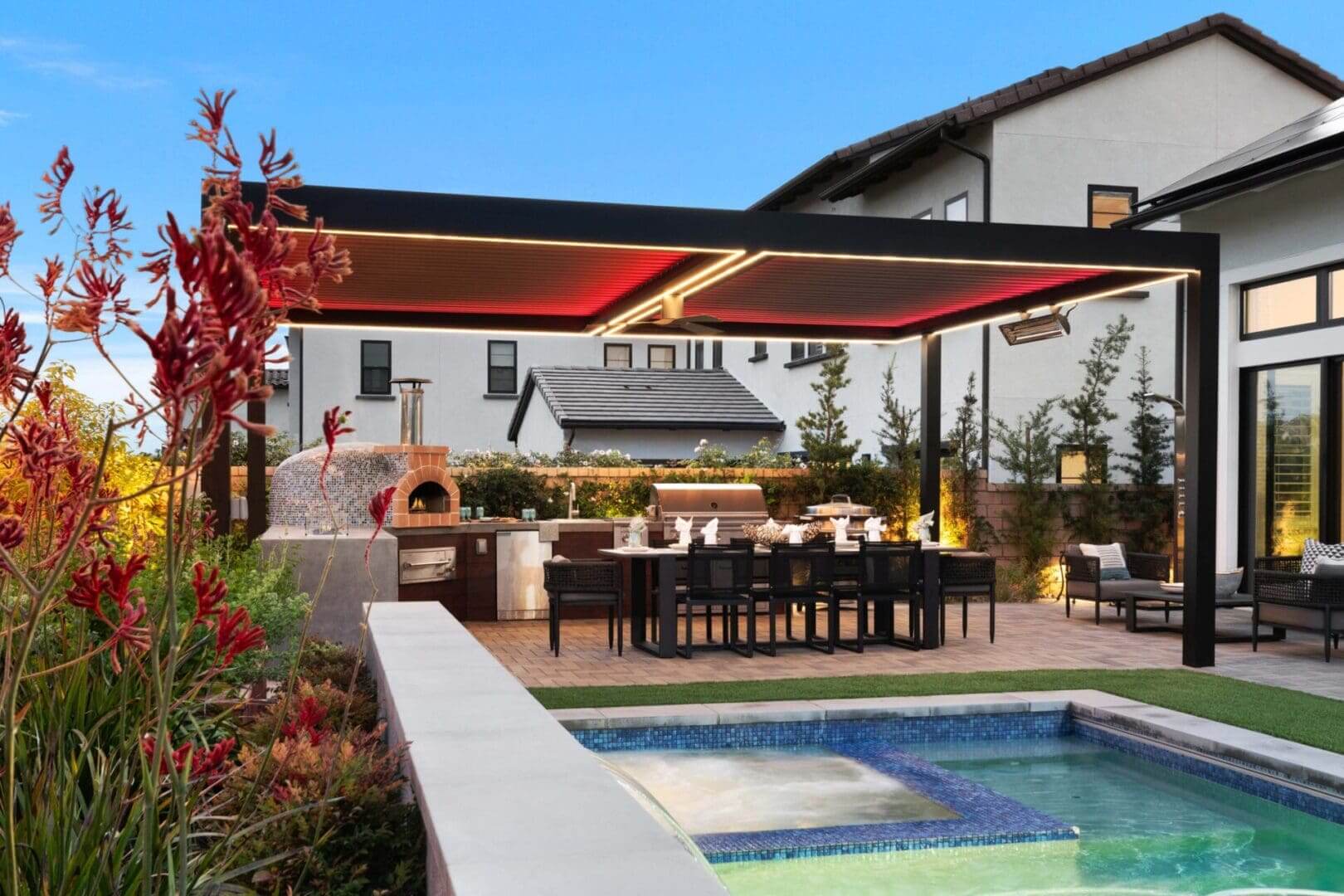 Modern pergola with outdoor kitchen, dining, pool