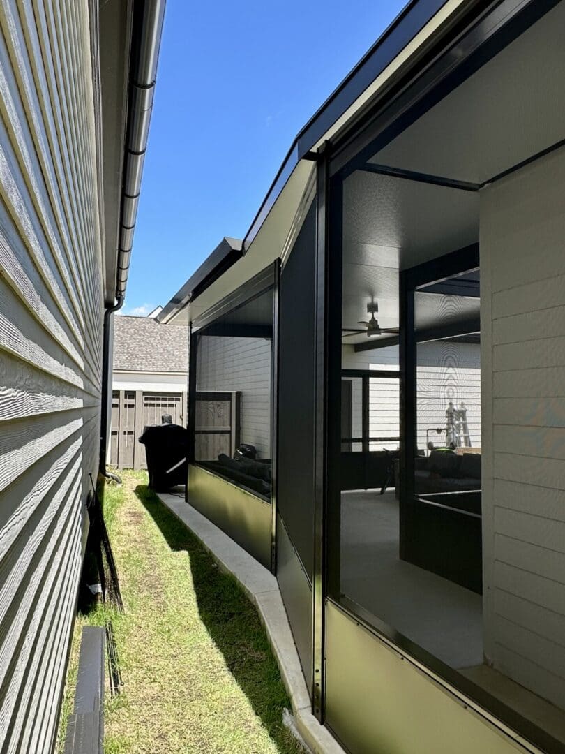 Narrow side yard with screened in porch