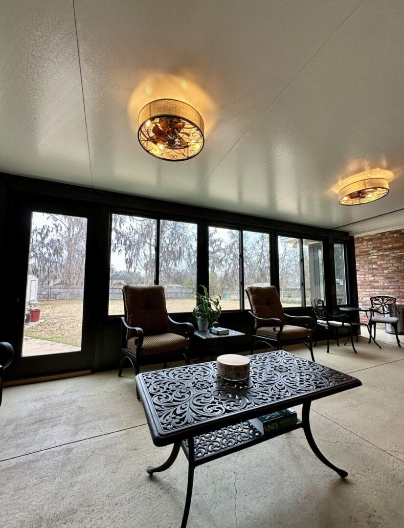 Sunroom with wrought iron table and chairs