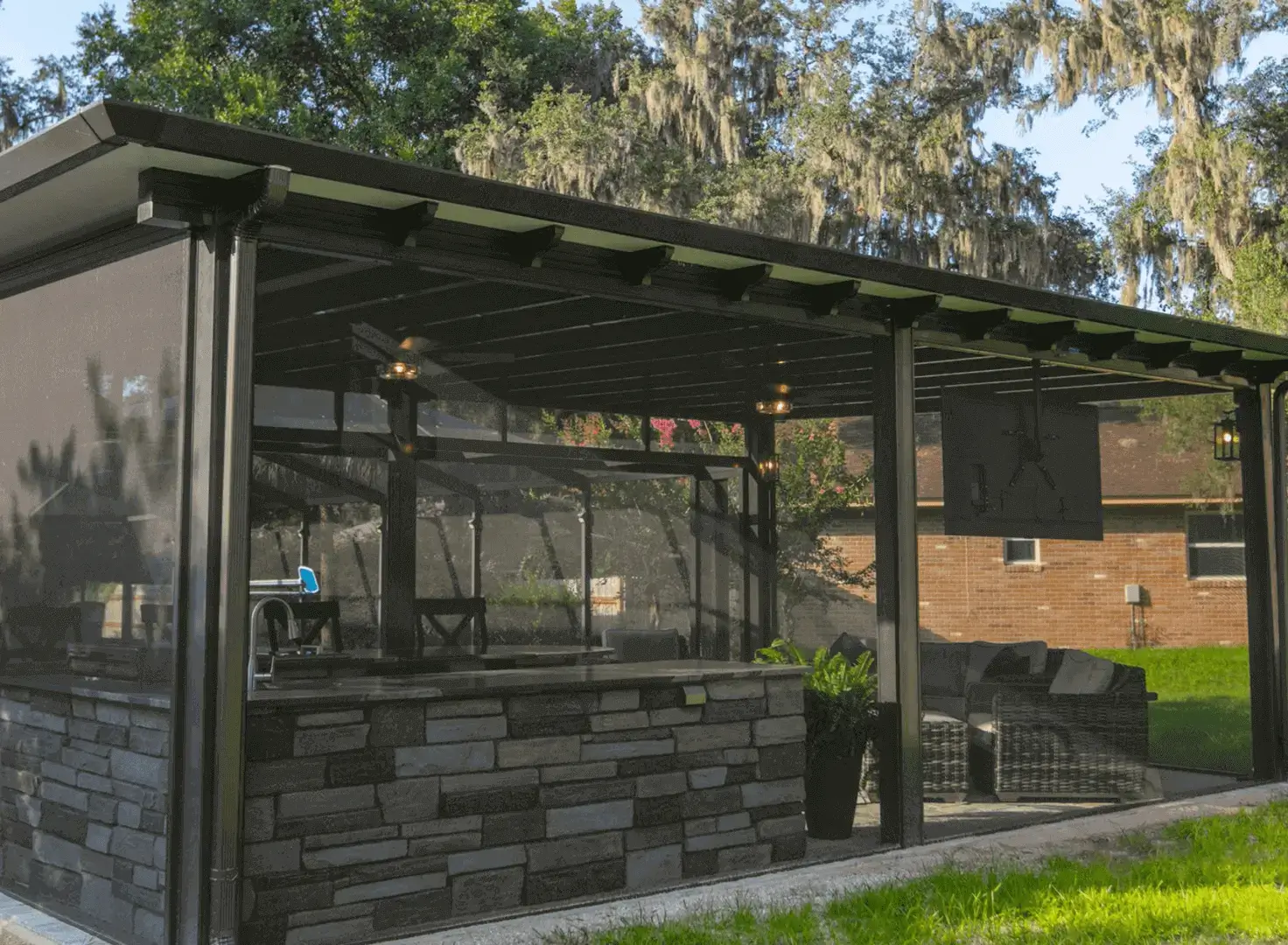 Modern screened outdoor patio with stone bar